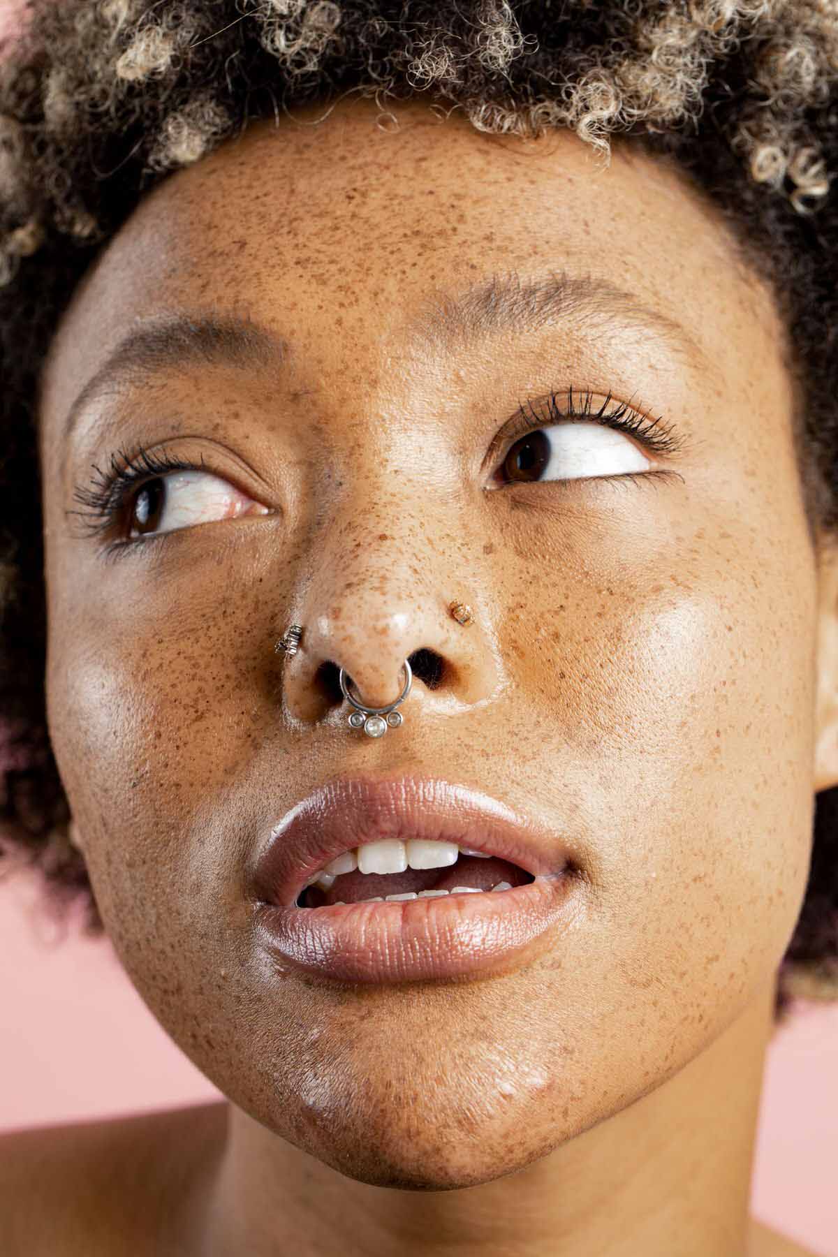 a full body model wearing a nose ring